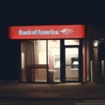 Illuminated Bank of America ATM structure against a dark nighttime backdrop in Boston.